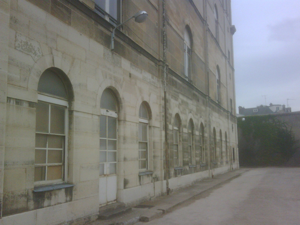 Prison Saint-Lazare, exterior view, infirmary wing, and prison wall.